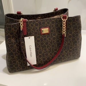 NWT Beautiful Brown with burgundy handles.